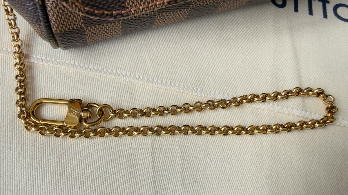 FAVORITE PM DAMIER EBENE CLUTCH/CROSSBODY BAG