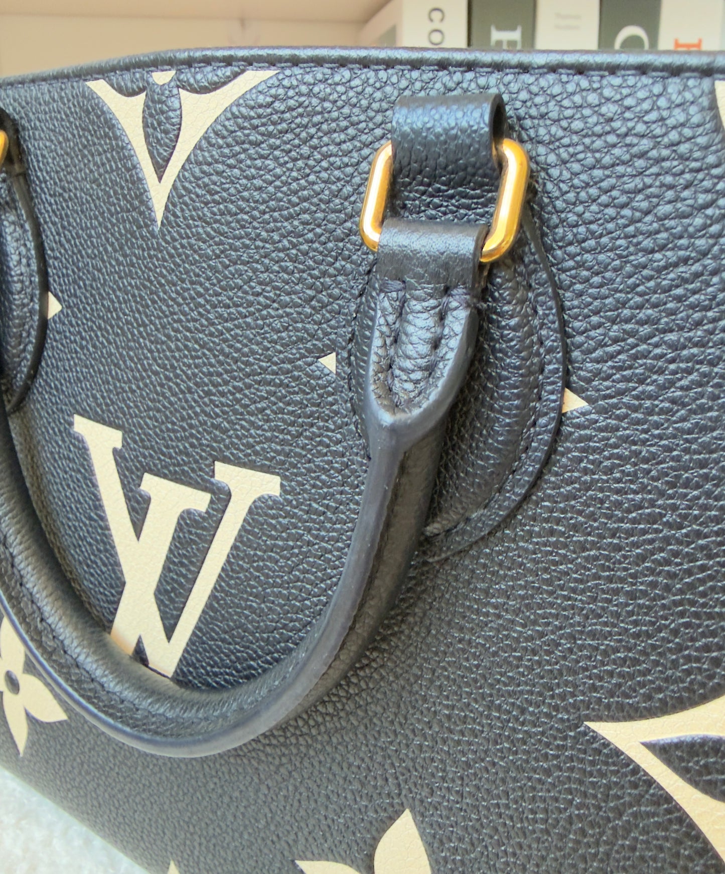 ONTHEGO PM BLACK/BEIGE EMPREINTE BAG